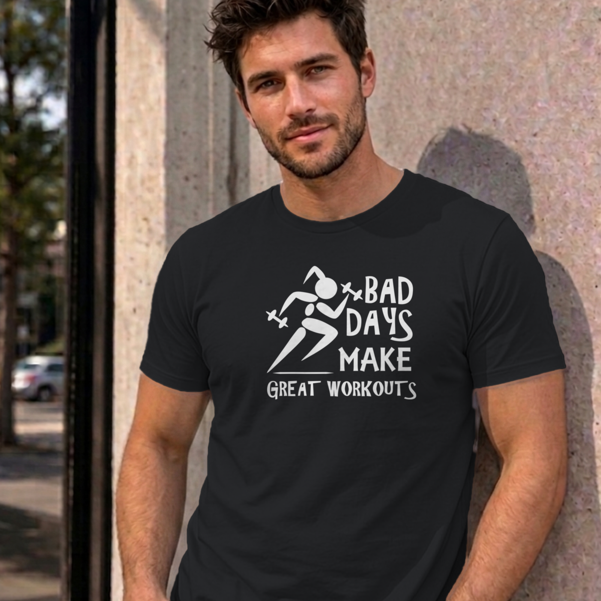 Man wearing the black Bad Days Make Great Workouts graphic tee