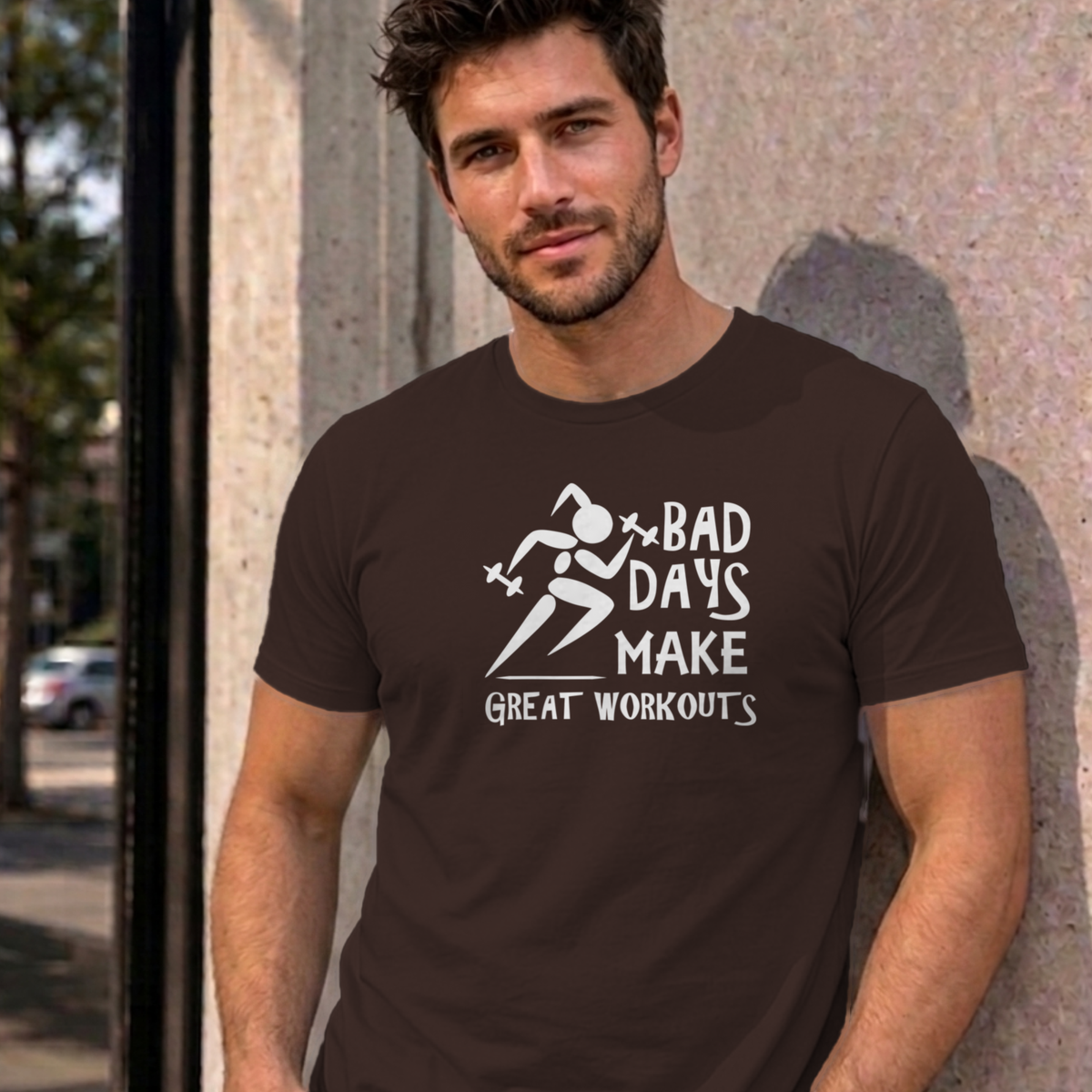Man wearing the dark chocolate Bad Days Make Great Workouts graphic tee