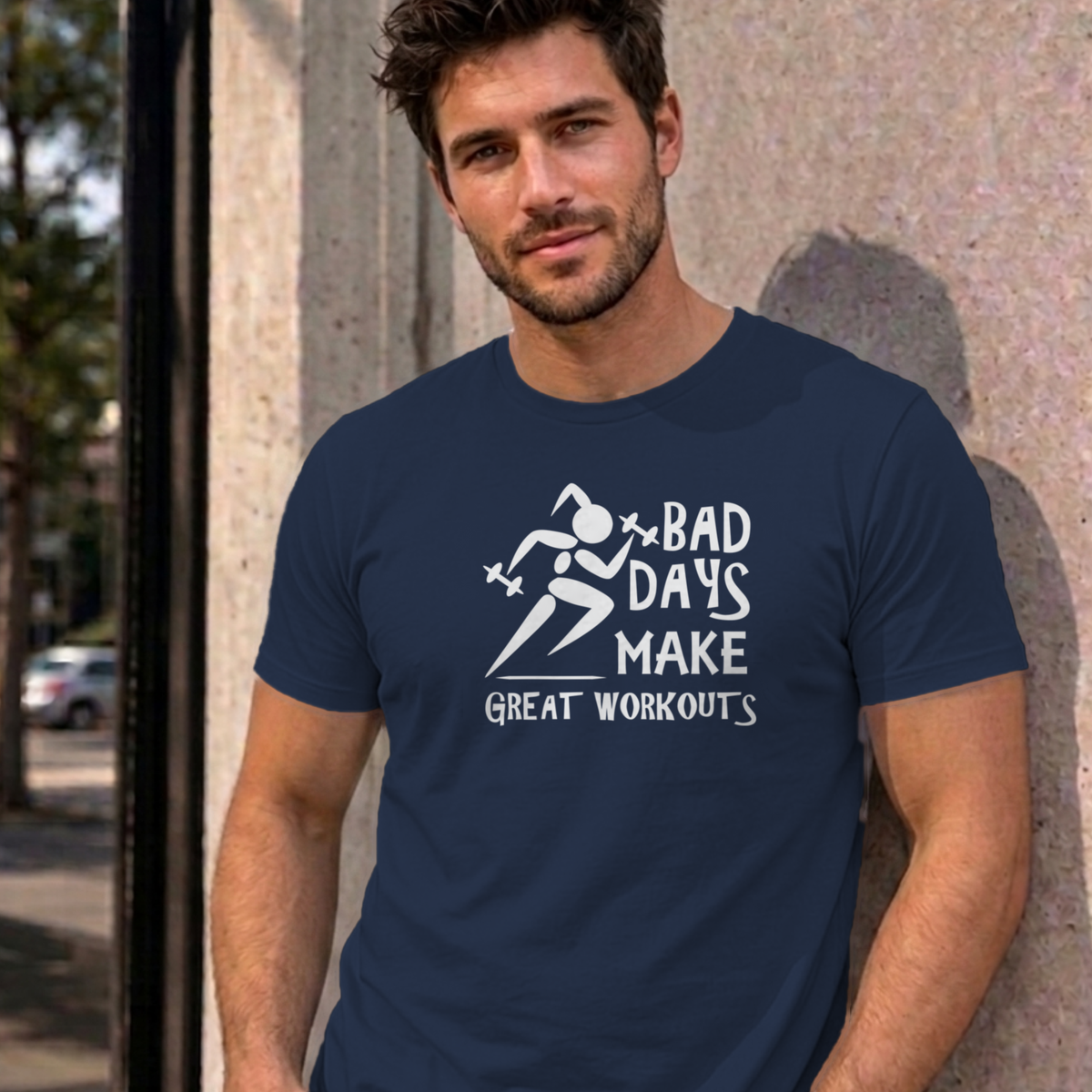 Man wearing the navy Bad Days Make Great Workouts graphic tee