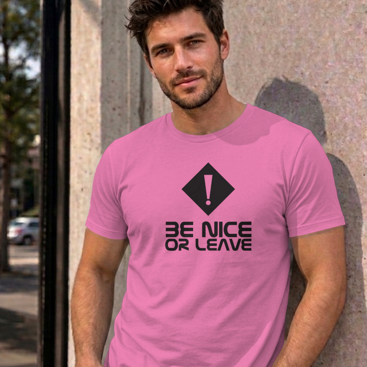 Man wearing the azalea Be Nice or Leave graphic tee