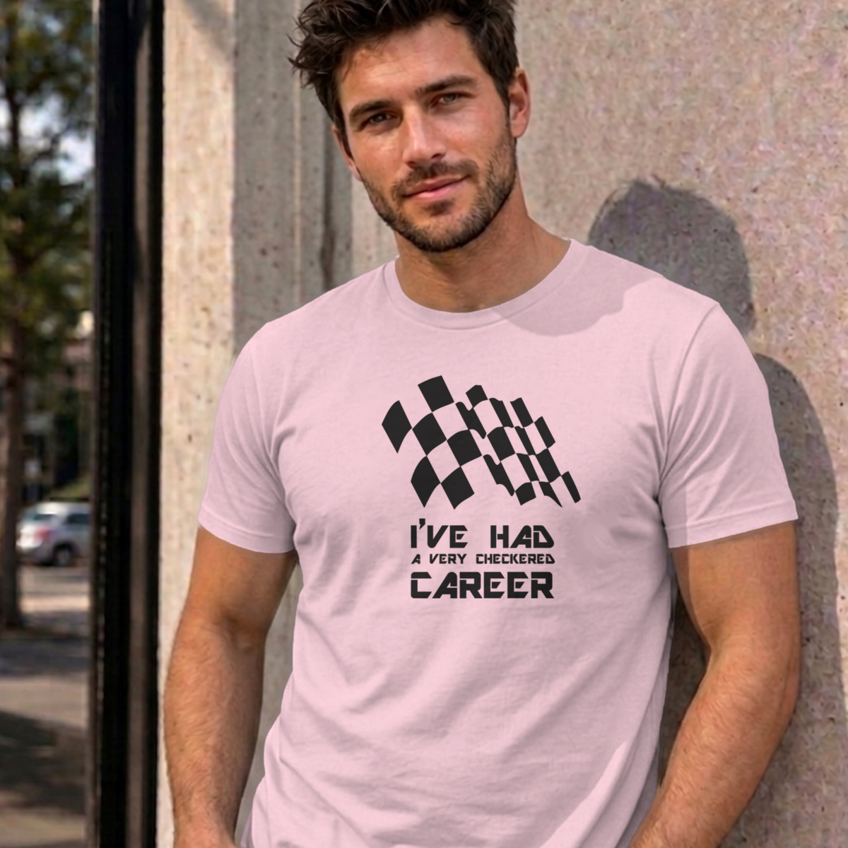 Man wearing the light pink Checkered Career graphic tee
