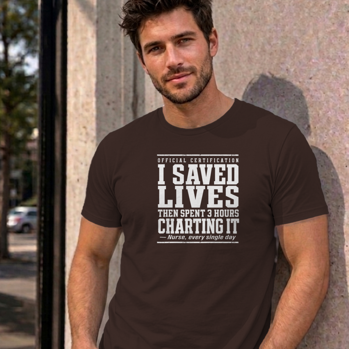 Man wearing the dark chocolate Nurse Charting graphic tee