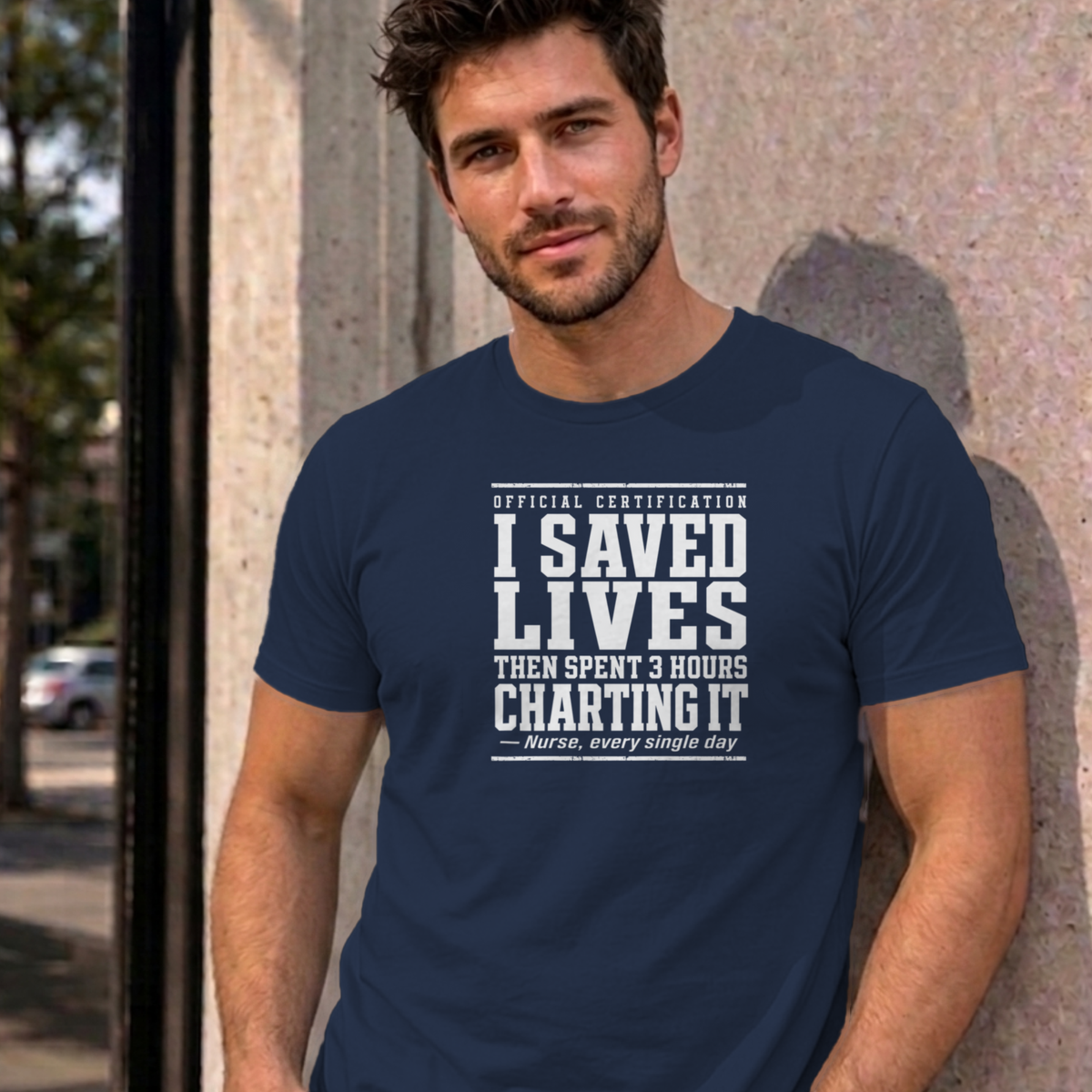Man wearing the navy Nurse Charting graphic tee