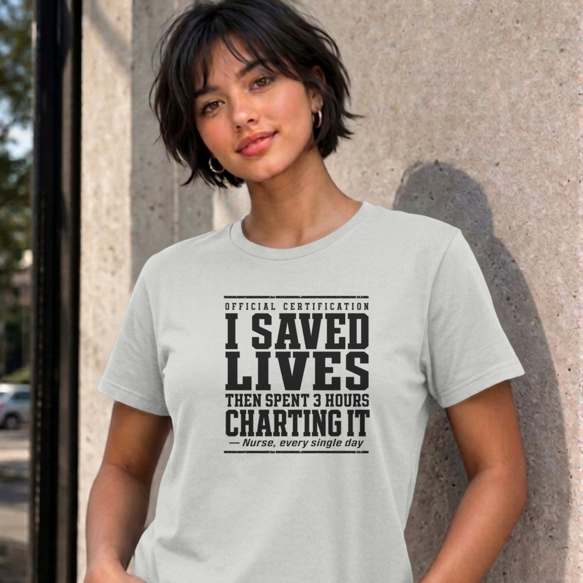 Woman wearing the ash Nurse Charting graphic tee