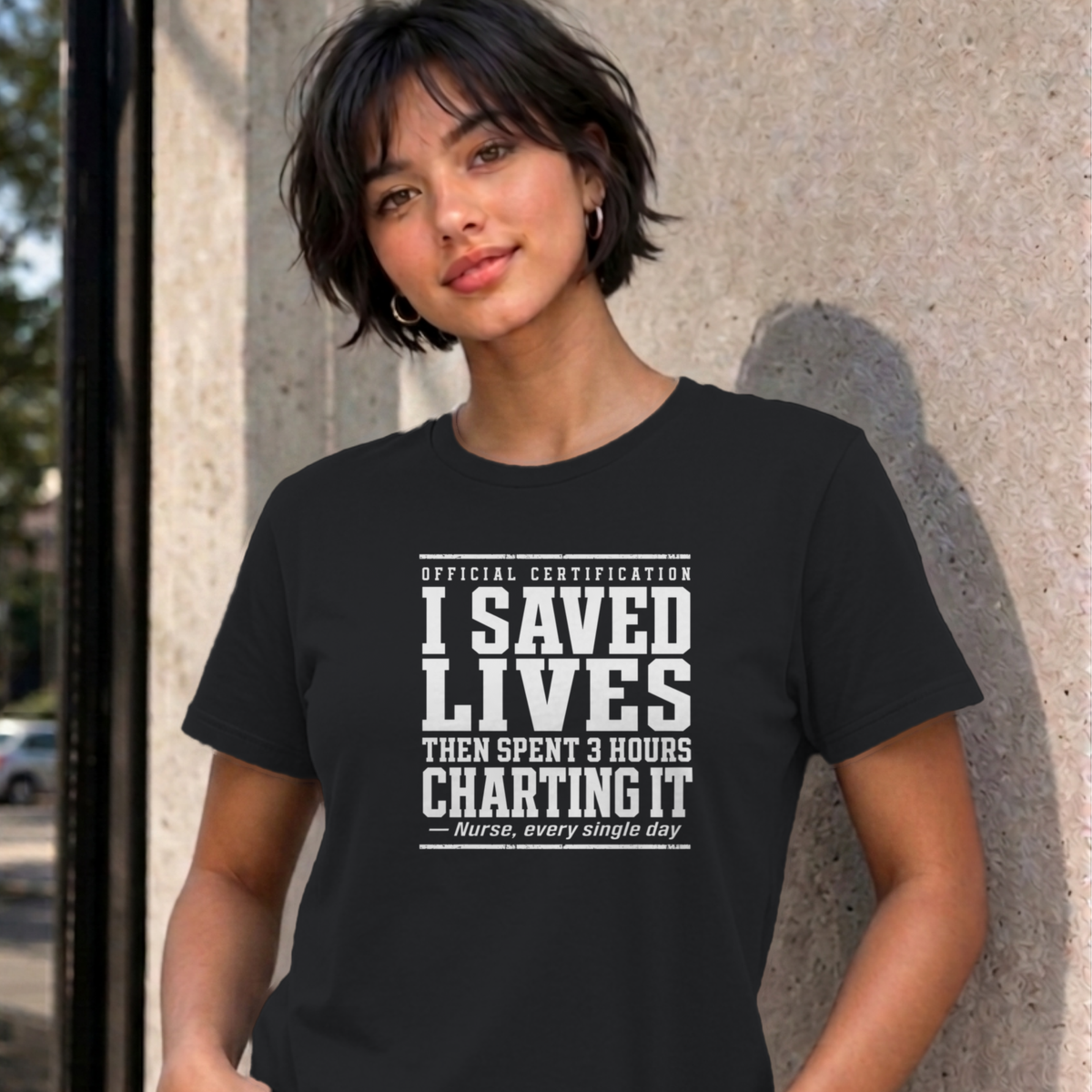 Woman wearing the black Nurse Charting graphic tee