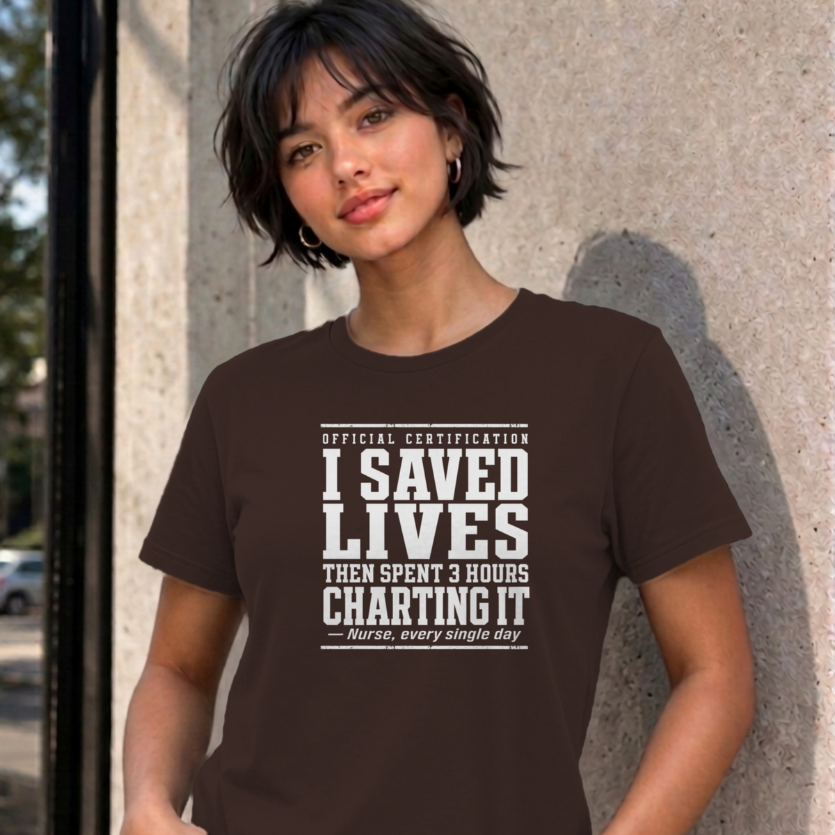 Woman wearing the dark chocolate Nurse Charting graphic tee