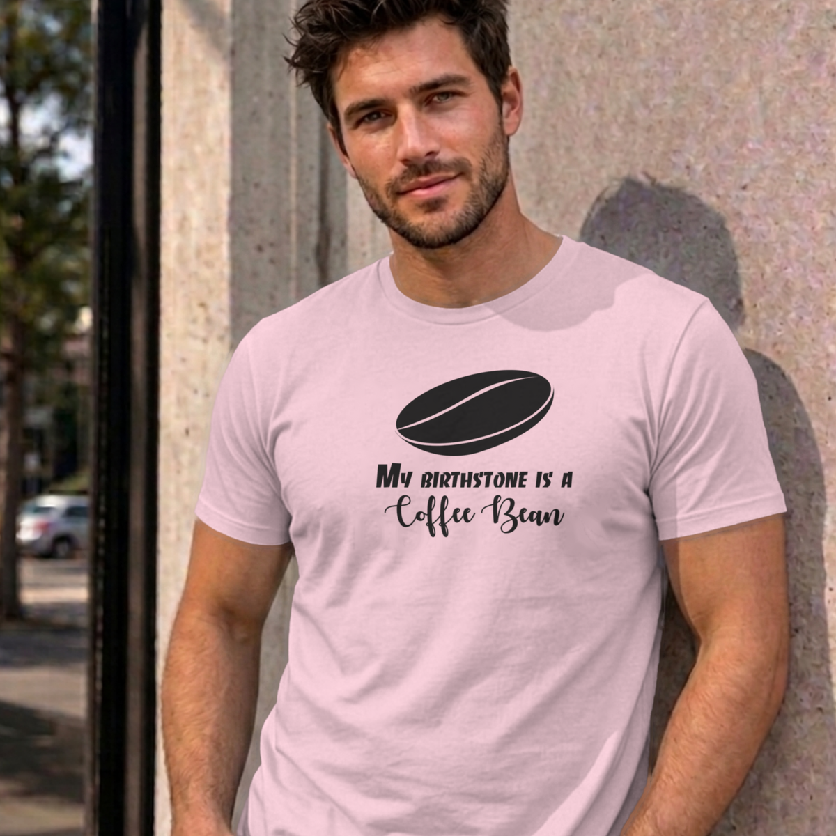 Man wearing the light pink My Birthstone Is a Coffee Bean graphic tee