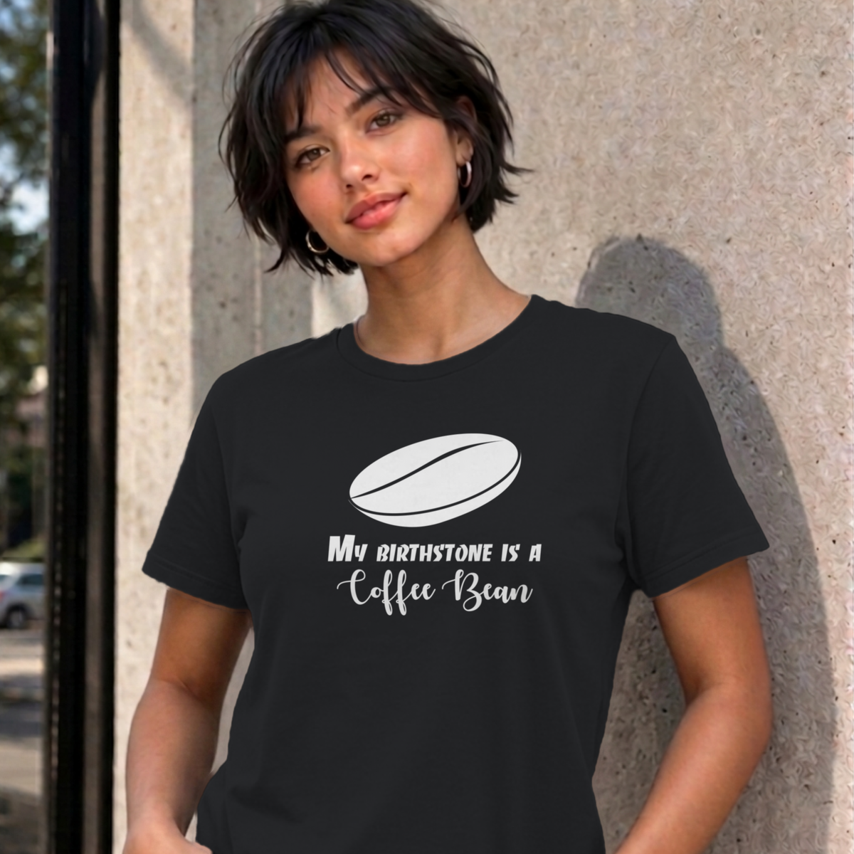 Woman wearing the black My Birthstone Is a Coffee Bean graphic tee