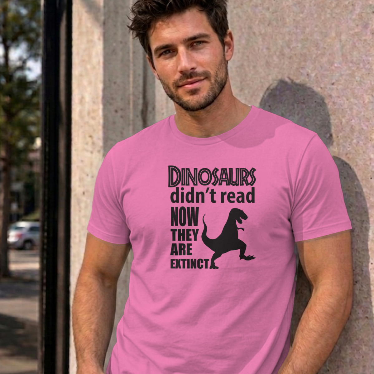 Man wearing the azalea Dinosaurs Didn't Read graphic tee