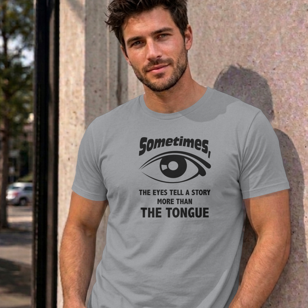 Man wearing the sport grey Eyes Tell a Story graphic tee