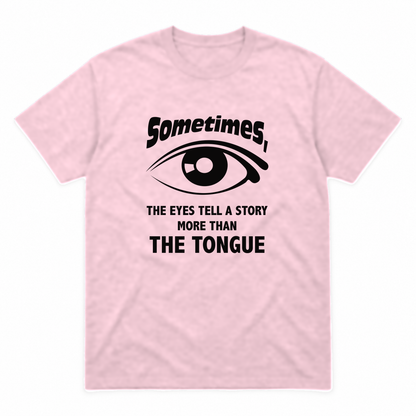 Eyes Tell a Story graphic tee in light pink with black print, front view