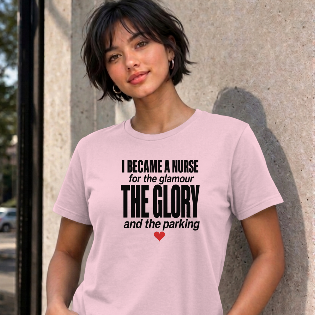 Woman wearing the light pink Nurse Glamour graphic tee