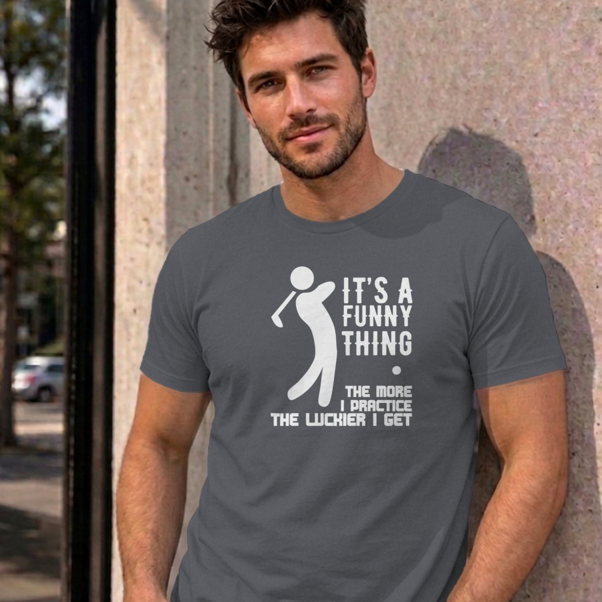 Man wearing the charcoal The More I Practice graphic tee