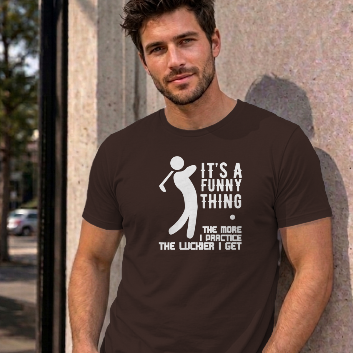 Man wearing the dark chocolate The More I Practice graphic tee