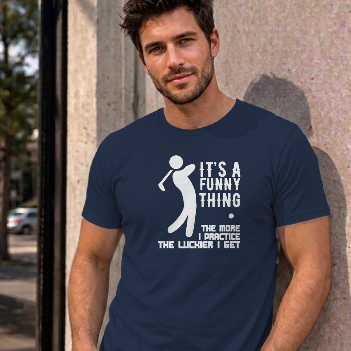 Man wearing the navy The More I Practice graphic tee