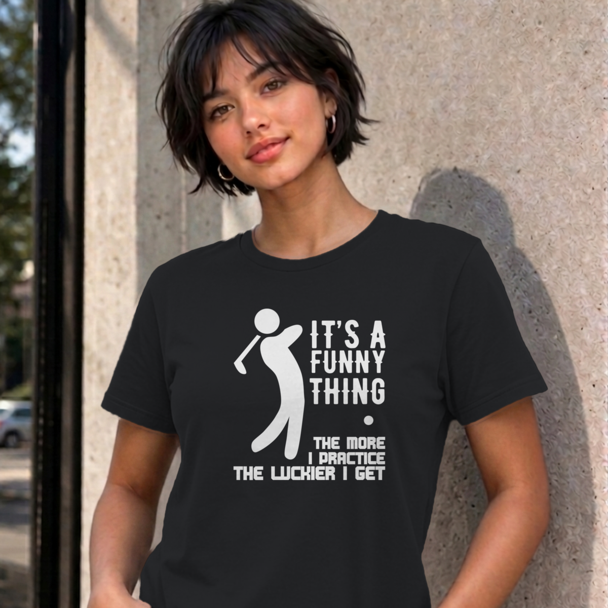 Woman wearing the black The More I Practice graphic tee