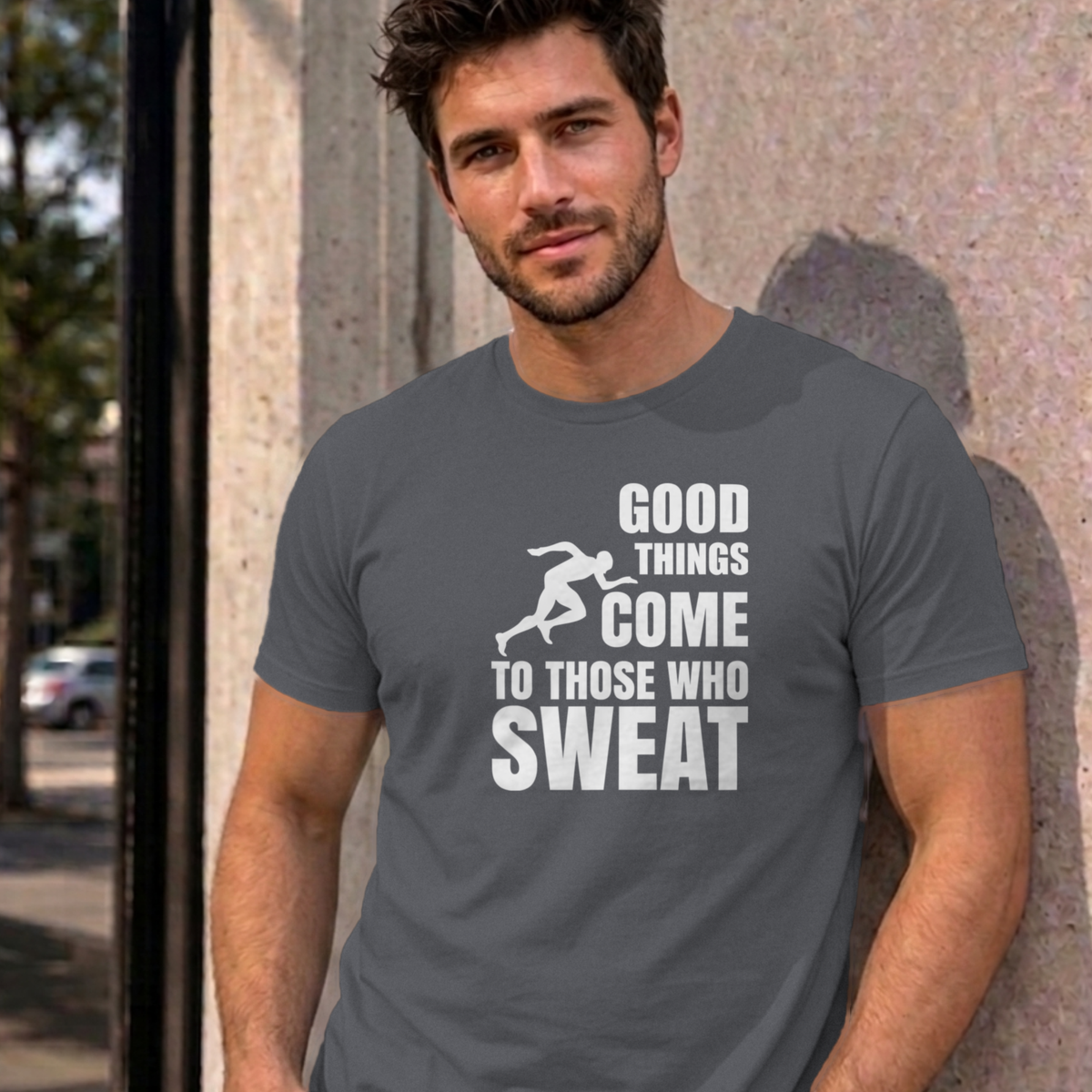 Man wearing the charcoal Good Things Come to Those Who Sweat graphic tee