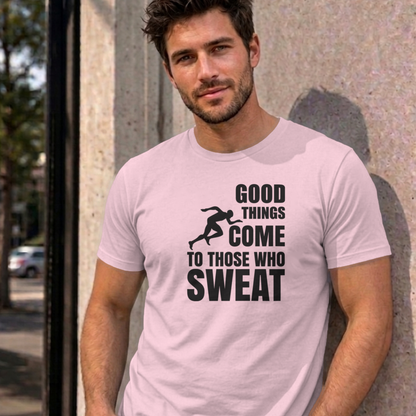 Man wearing the light pink Good Things Come to Those Who Sweat graphic tee