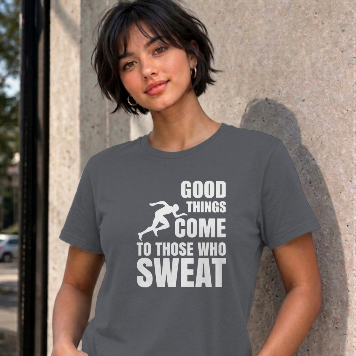 Woman wearing the charcoal Good Things Come to Those Who Sweat graphic tee
