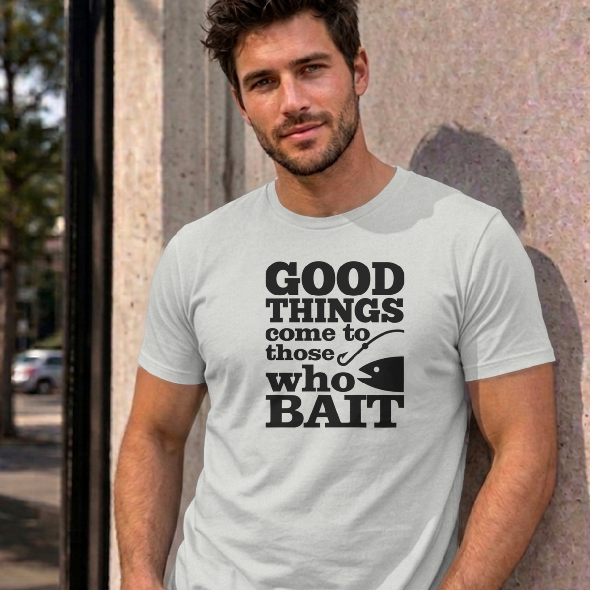 Man wearing the ash Good Things Come to Those Who Bait graphic tee