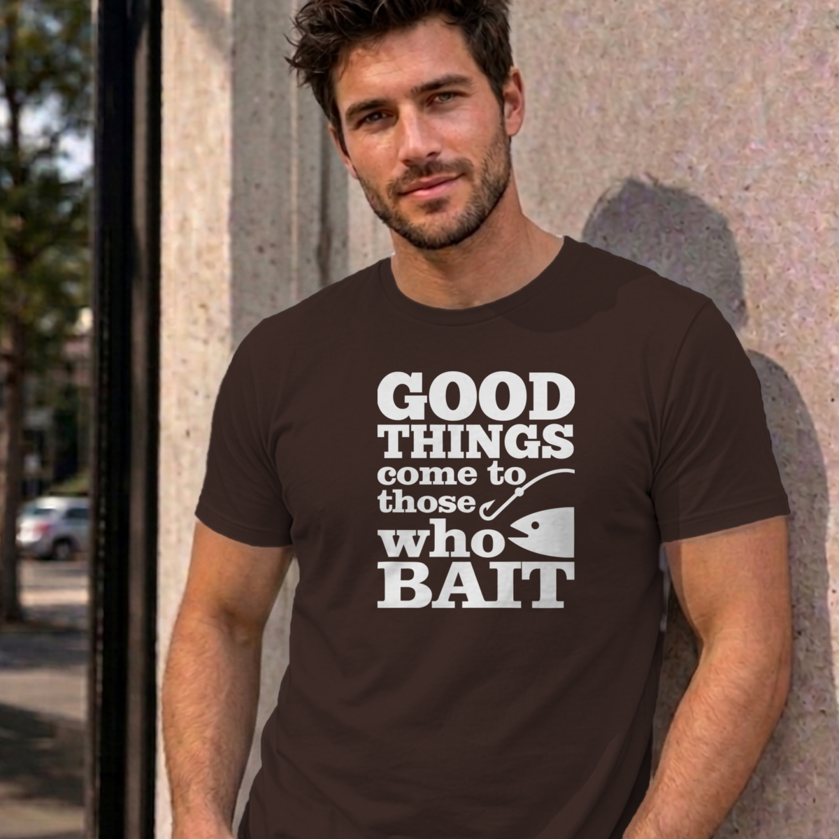 Man wearing the dark chocolate Good Things Come to Those Who Bait graphic tee