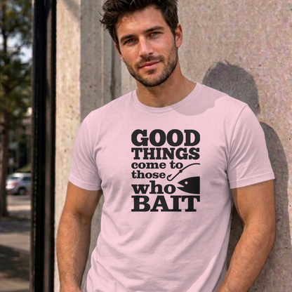 Man wearing the light pink Good Things Come to Those Who Bait graphic tee