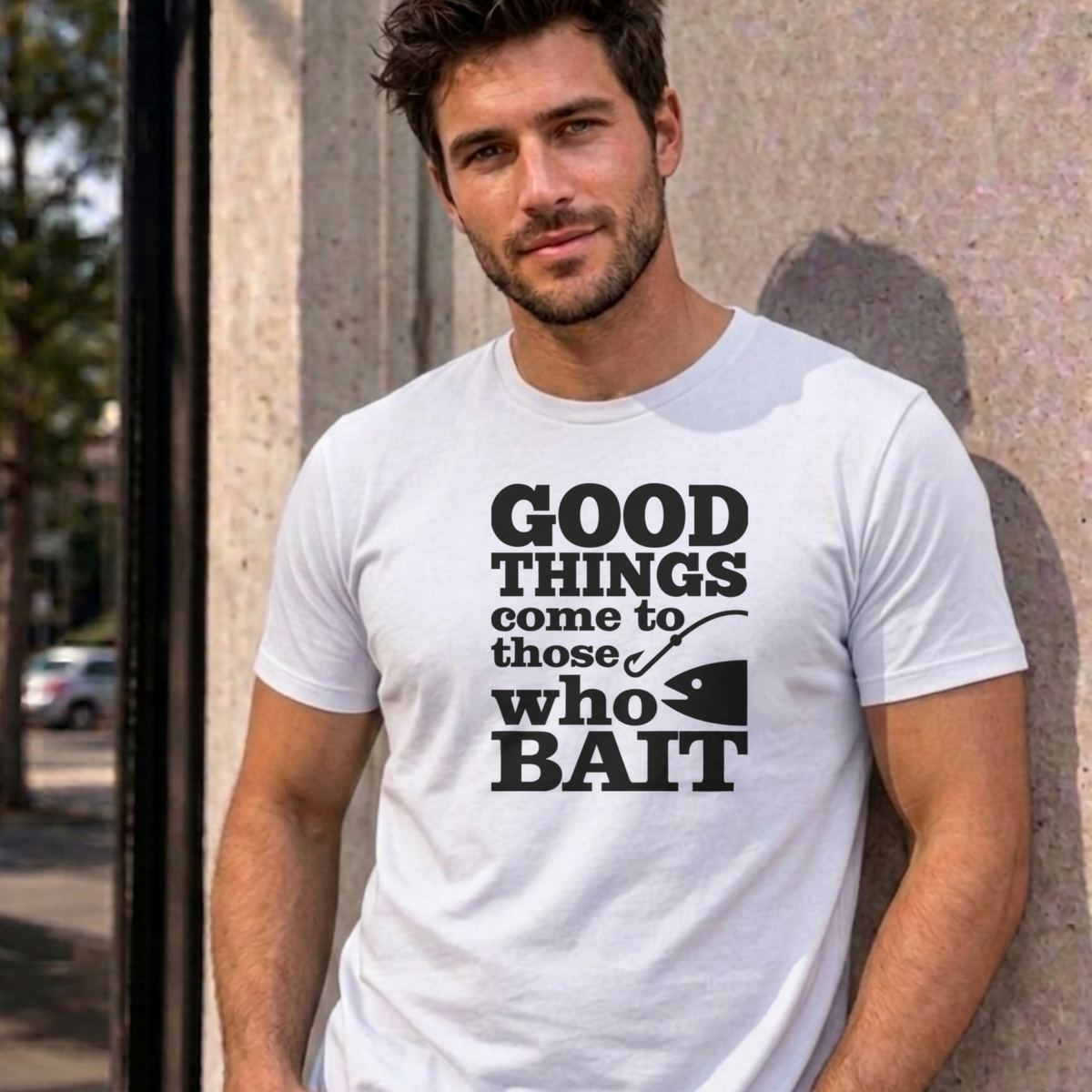Man wearing the white Good Things Come to Those Who Bait graphic tee