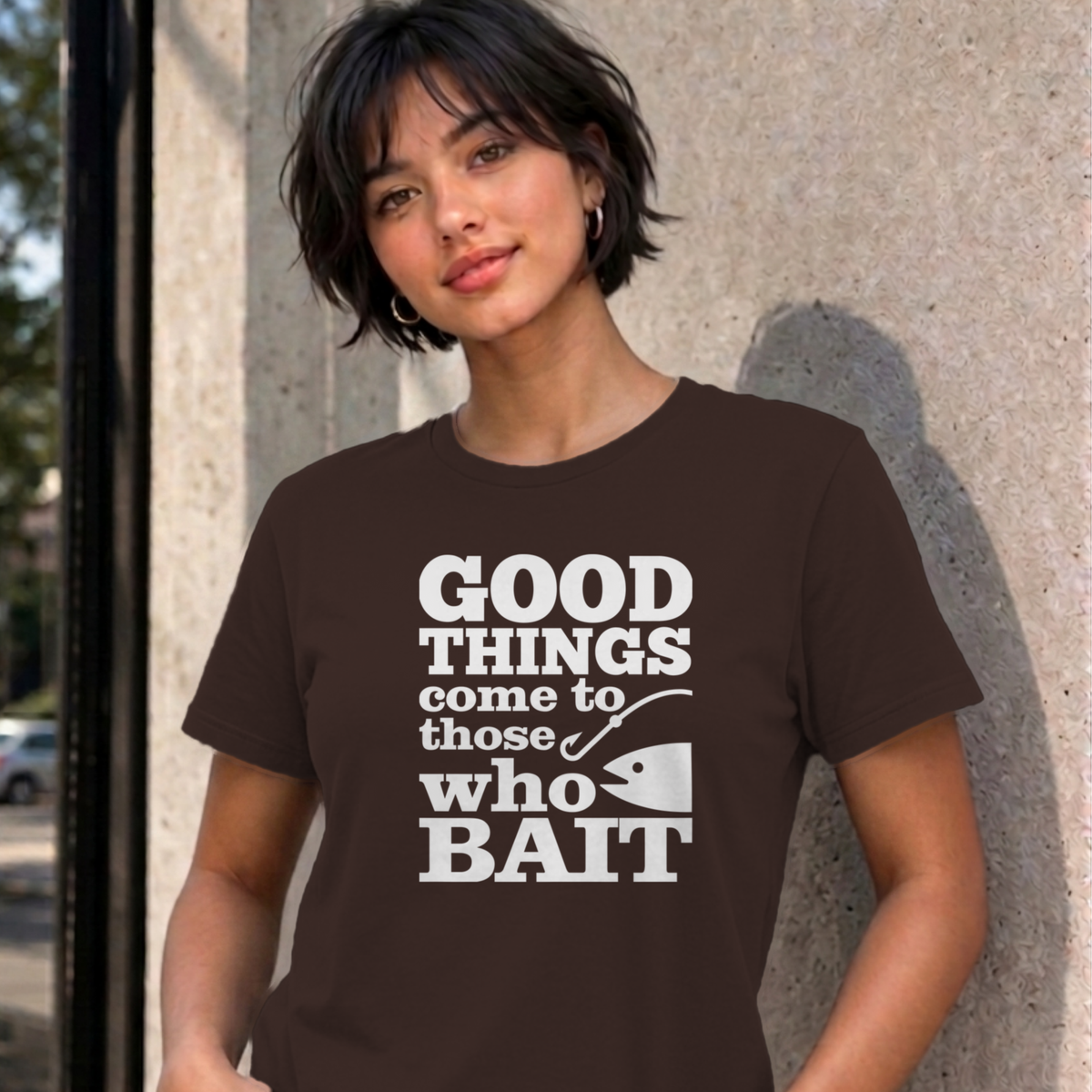 Woman wearing the dark chocolate Good Things Come to Those Who Bait graphic tee