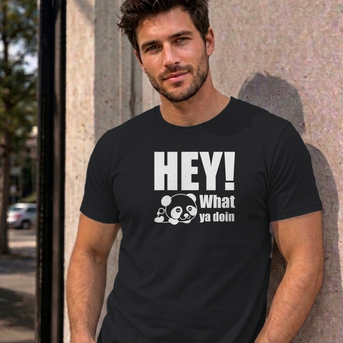 Man wearing the black Hey! What Ya Doin graphic tee