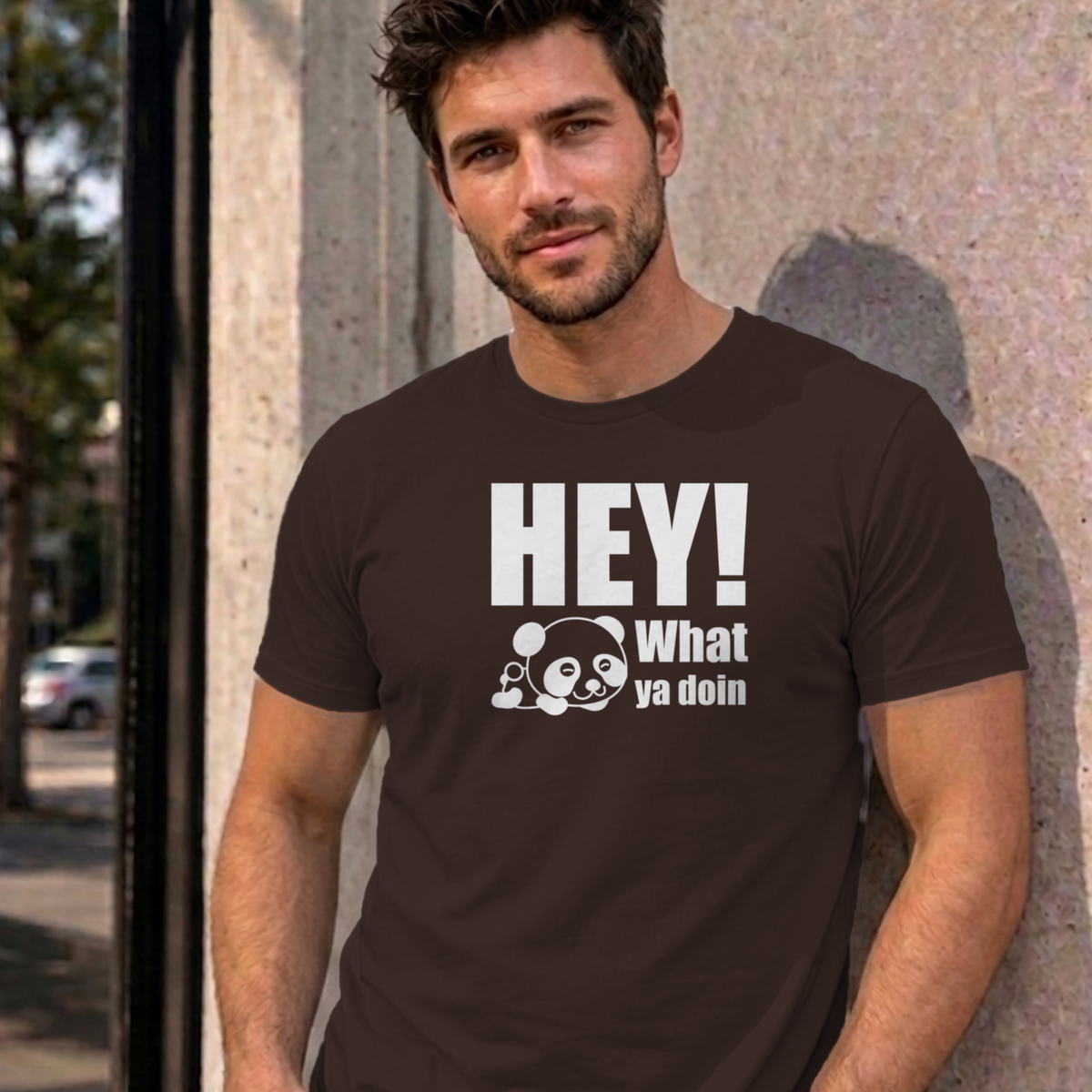 Man wearing the dark chocolate Hey! What Ya Doin graphic tee