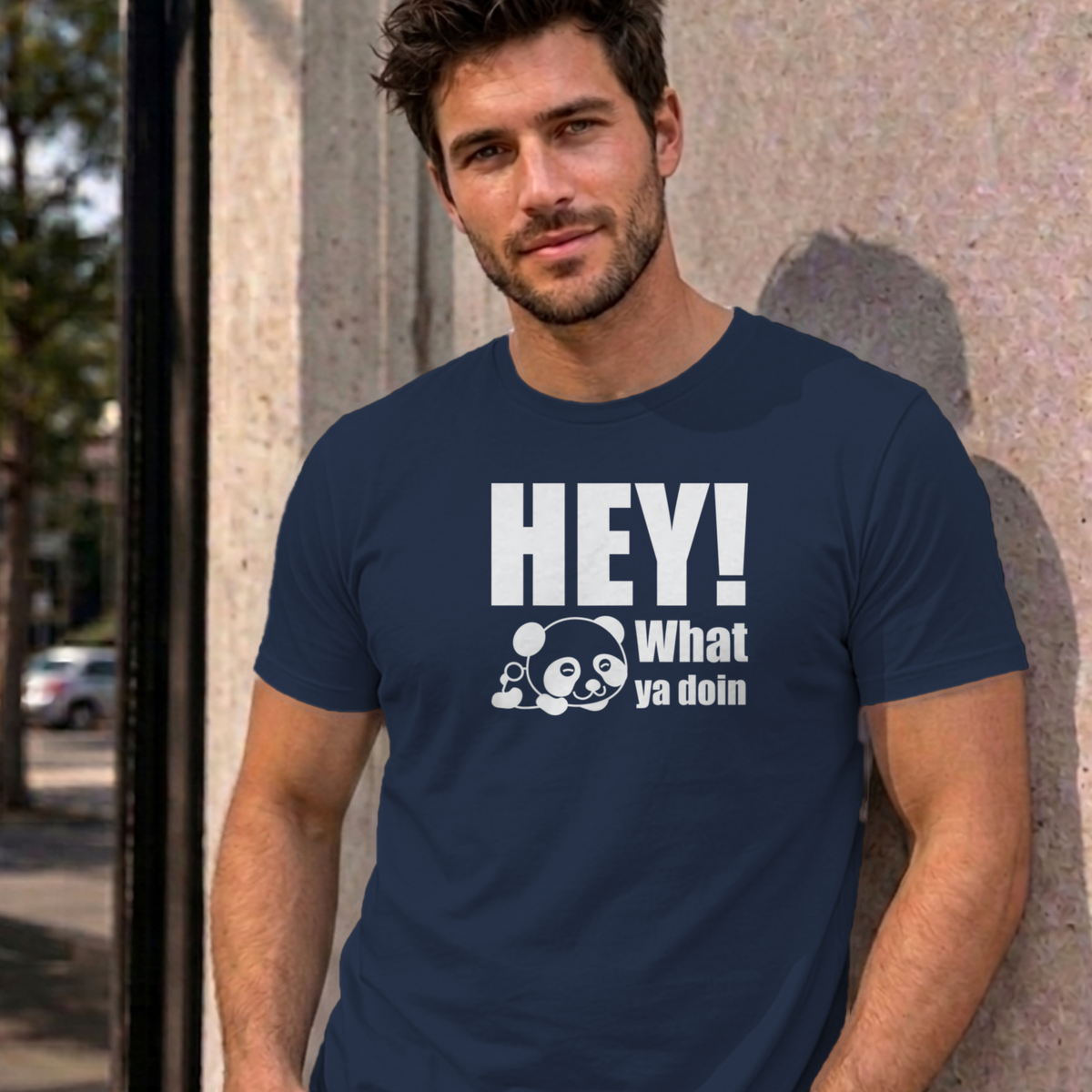Man wearing the navy Hey! What Ya Doin graphic tee