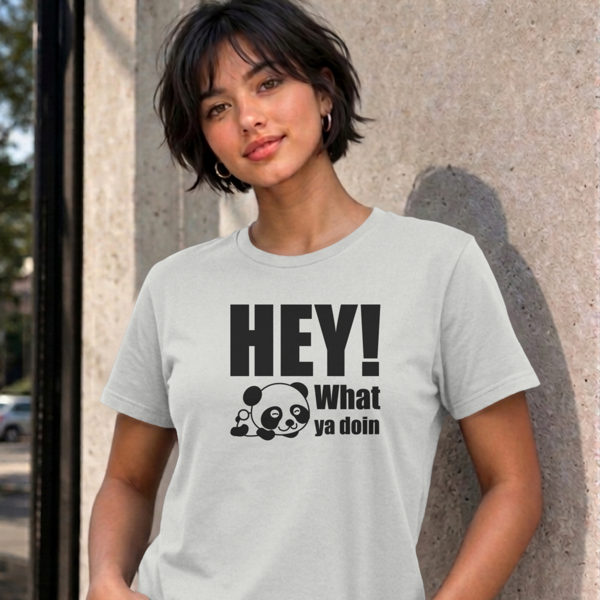 Woman wearing the ash Hey! What Ya Doin graphic tee