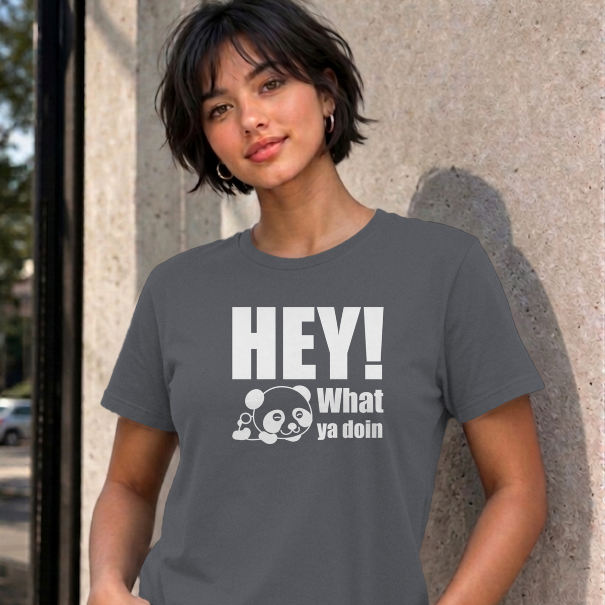 Woman wearing the charcoal Hey! What Ya Doin graphic tee