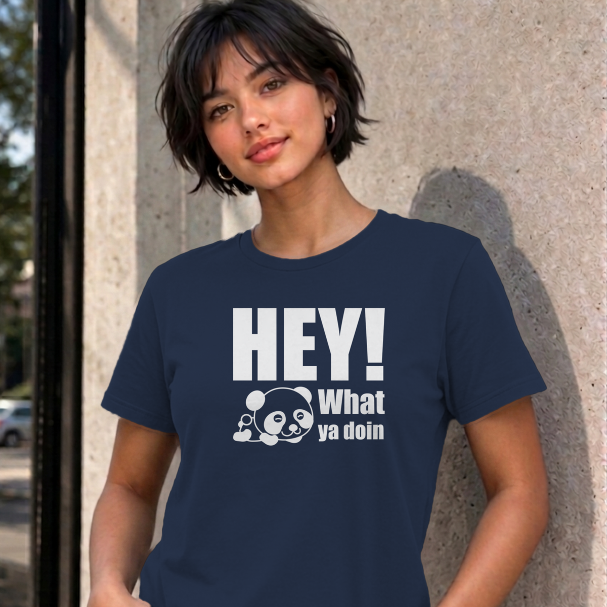 Woman wearing the navy Hey! What Ya Doin graphic tee