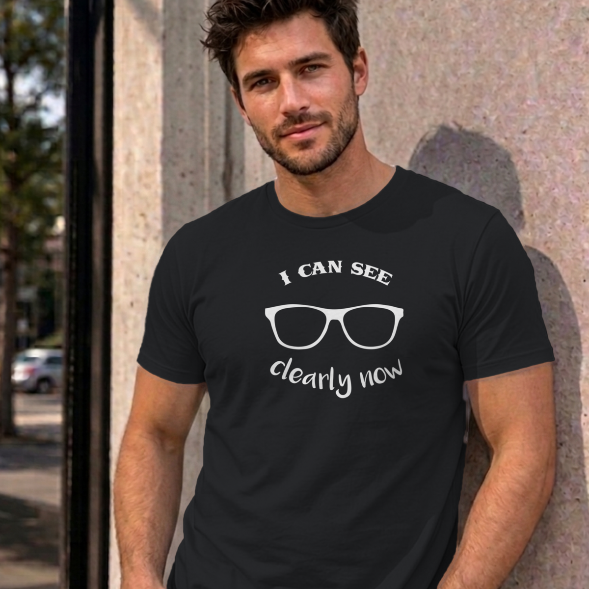 Man wearing the black I Can See Clearly Now graphic tee