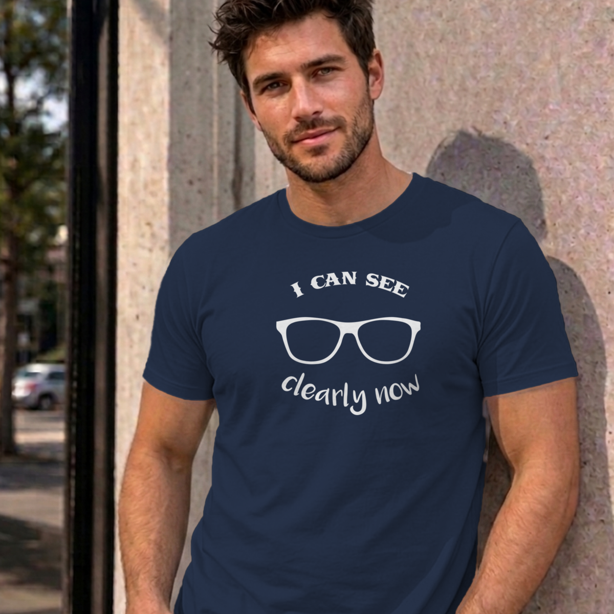 Man wearing the navy I Can See Clearly Now graphic tee