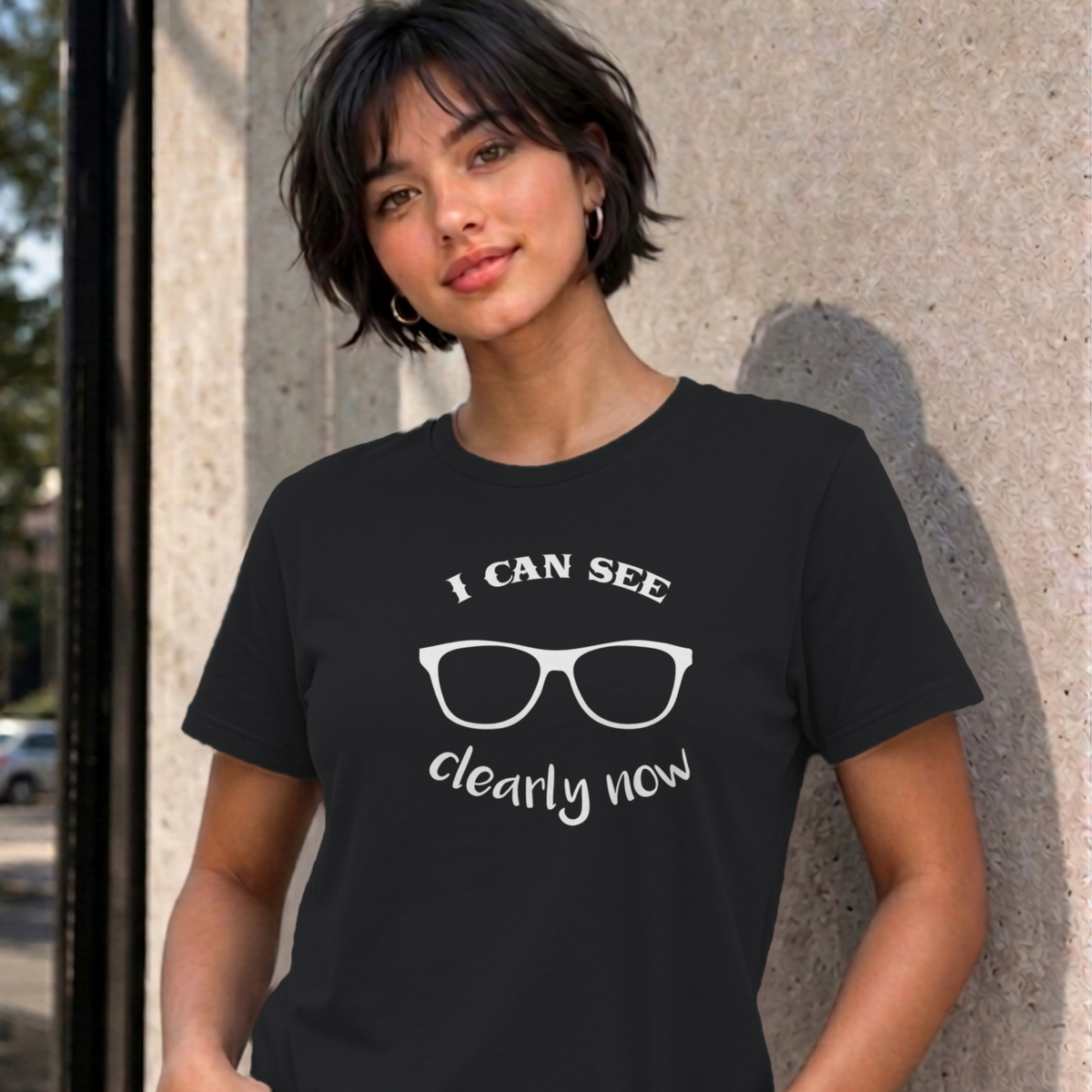 Woman wearing the black I Can See Clearly Now graphic tee