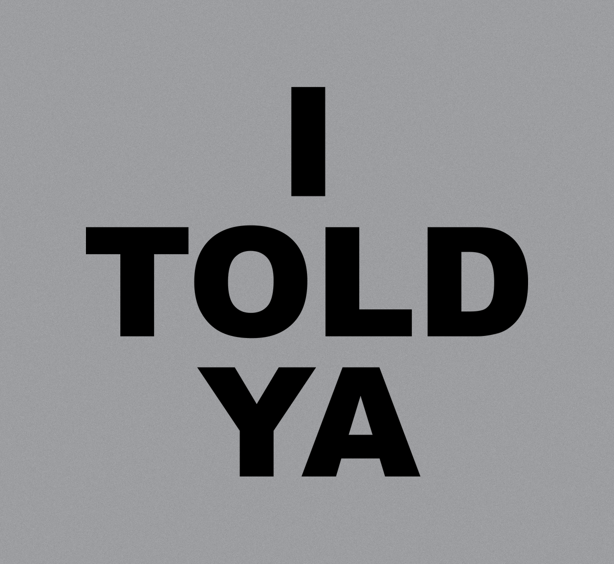 Close-up of the I Told Ya bold block lettering print