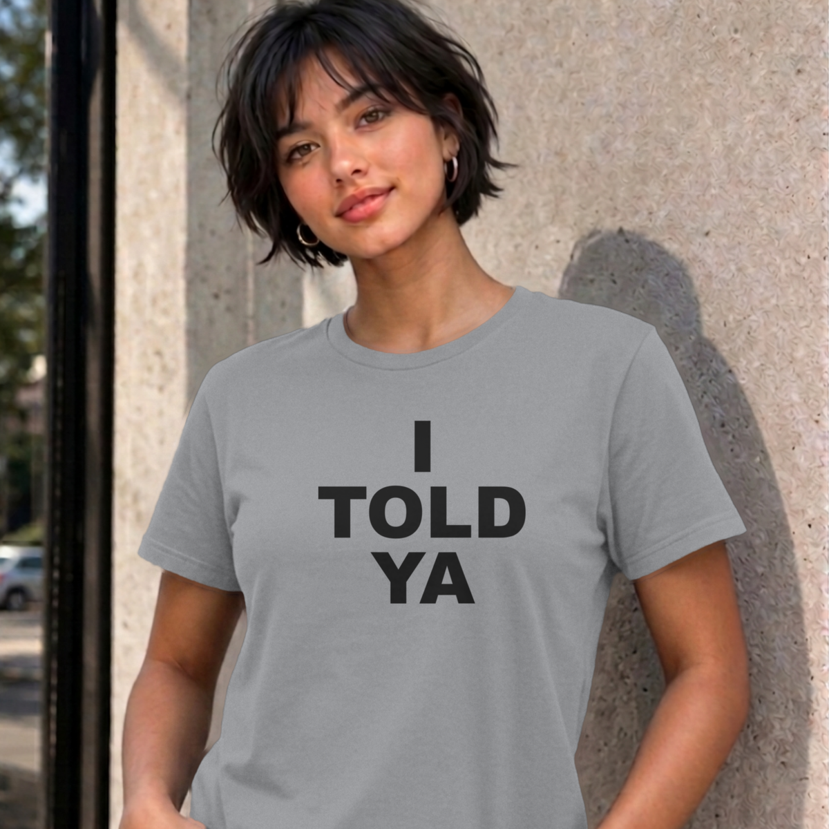 Woman wearing the sport grey I Told Ya graphic tee