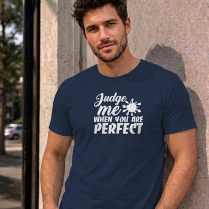Man wearing the navy Judge Me When You Are Perfect graphic tee