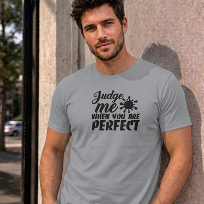 Man wearing the sport grey Judge Me When You Are Perfect graphic tee