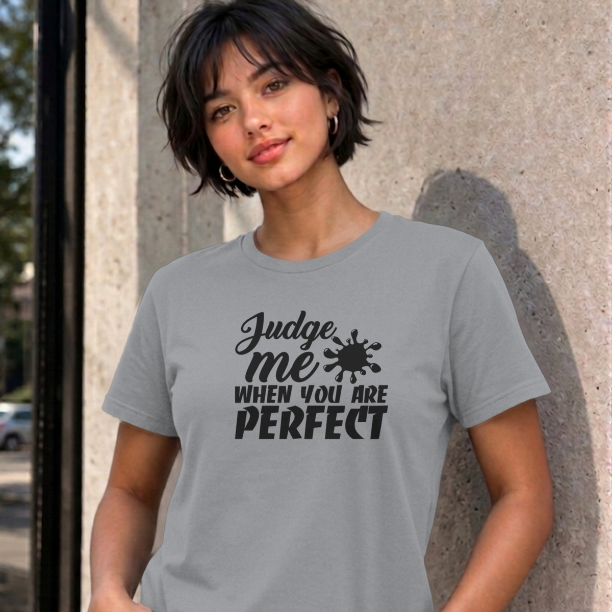 Woman wearing the sport grey Judge Me When You Are Perfect graphic tee