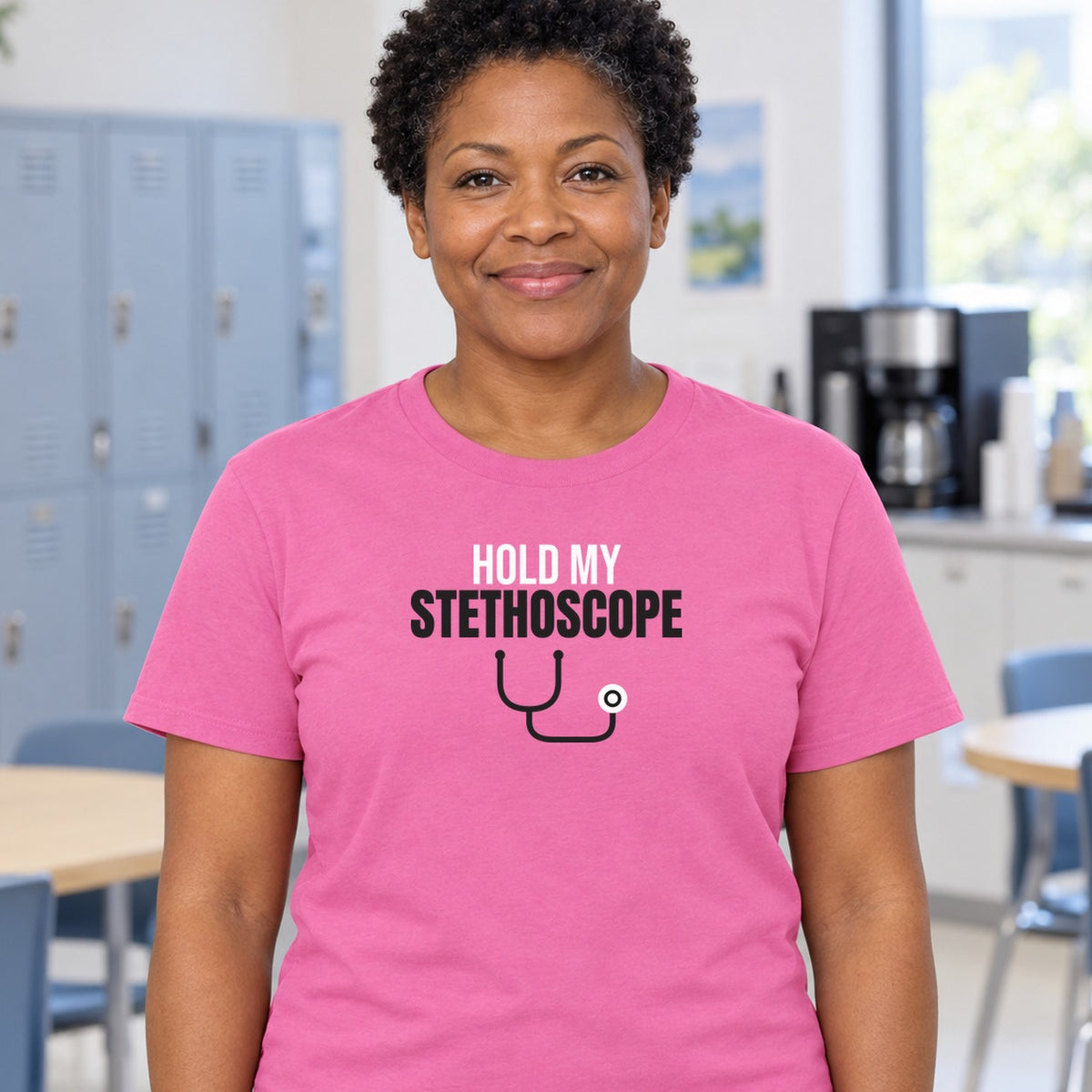 Woman wearing the azalea Hold My Stethoscope graphic tee