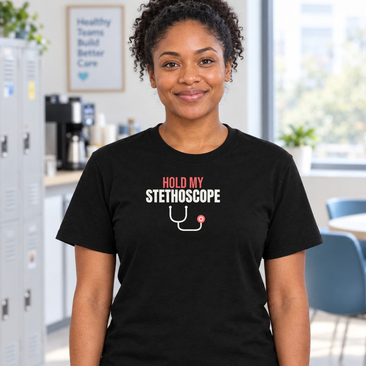 Woman wearing the black Hold My Stethoscope graphic tee
