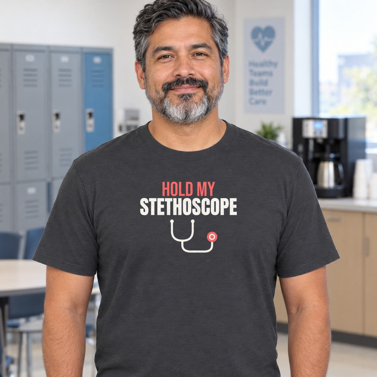 Man wearing the charcoal Hold My Stethoscope graphic tee