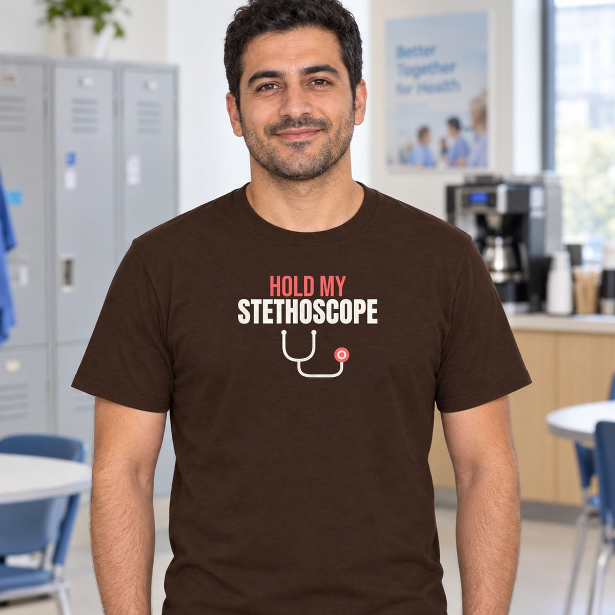 Man wearing the dark chocolate Hold My Stethoscope graphic tee