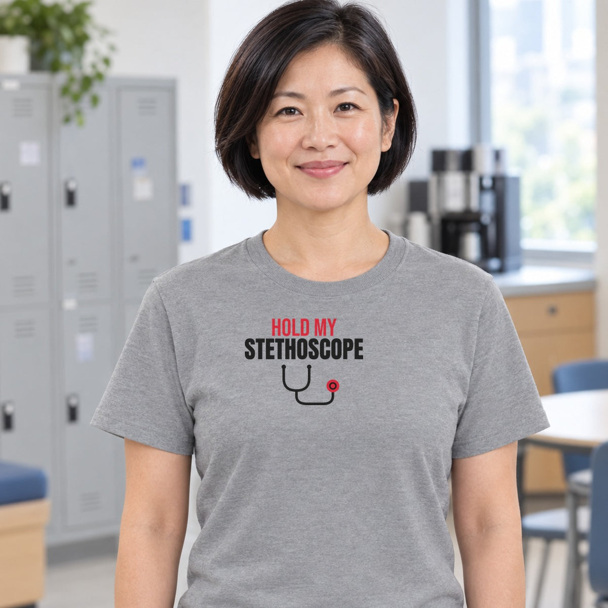 Woman wearing the sport grey Hold My Stethoscope graphic tee