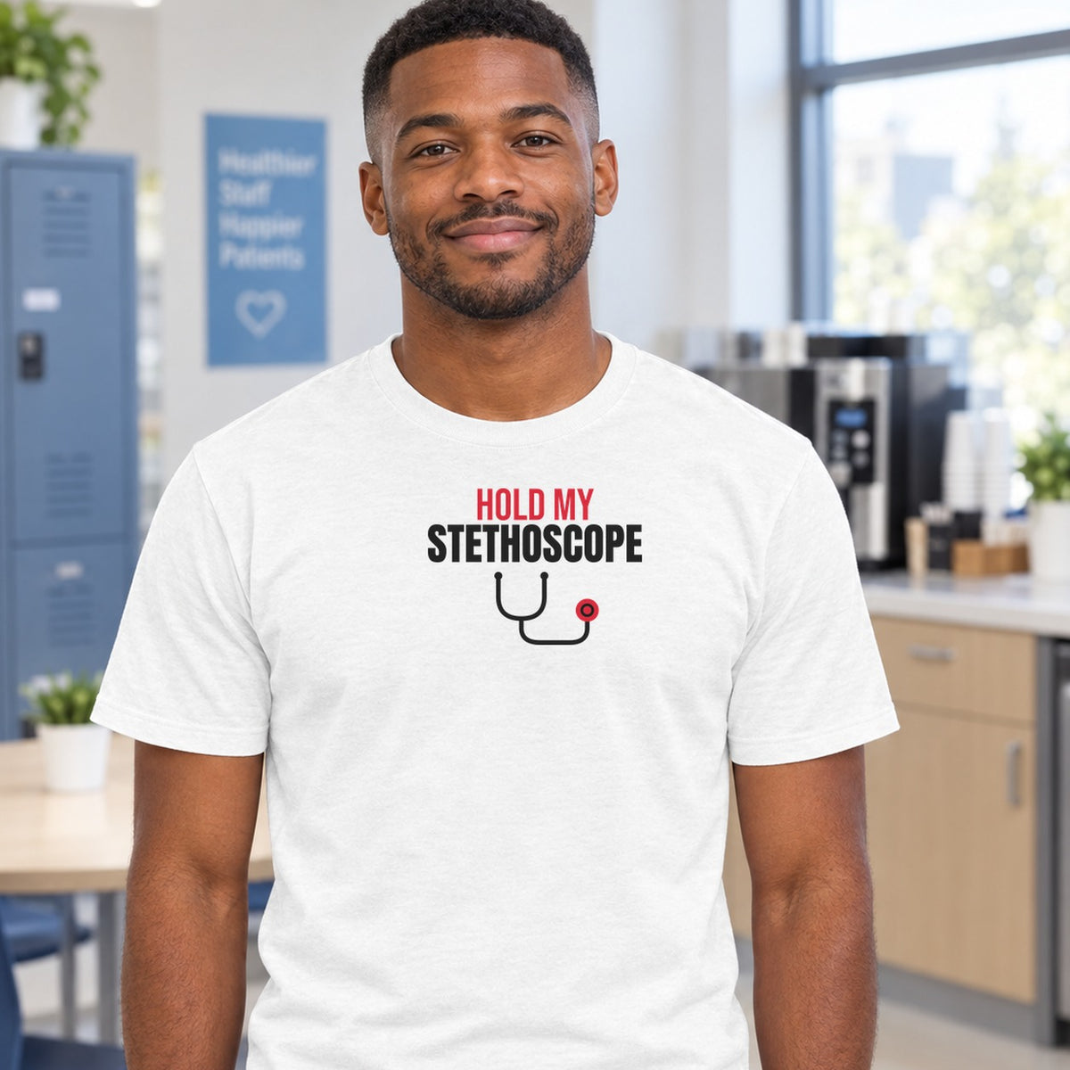 Man wearing the white Hold My Stethoscope graphic tee