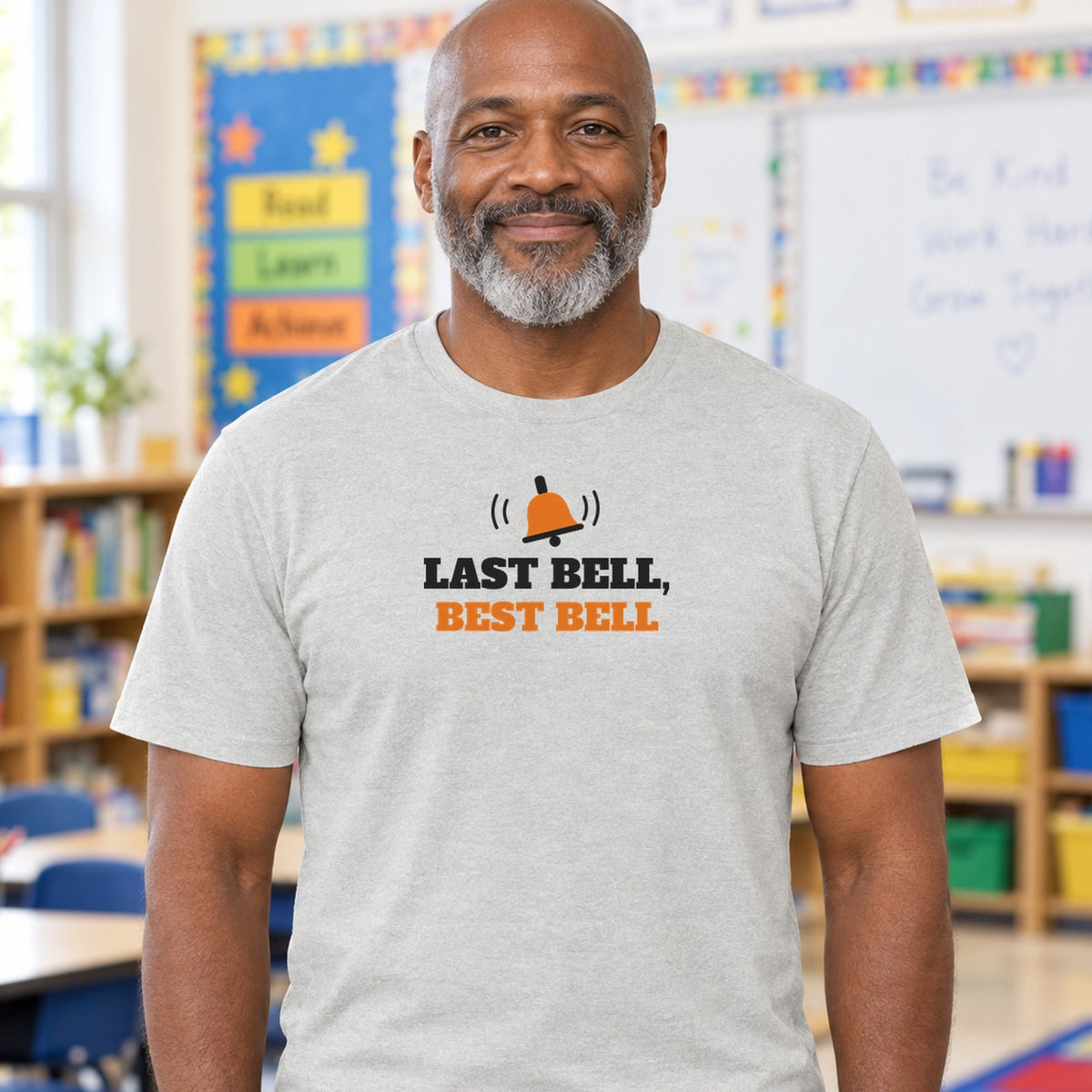 Man wearing the ash Last Bell, Best Bell graphic tee