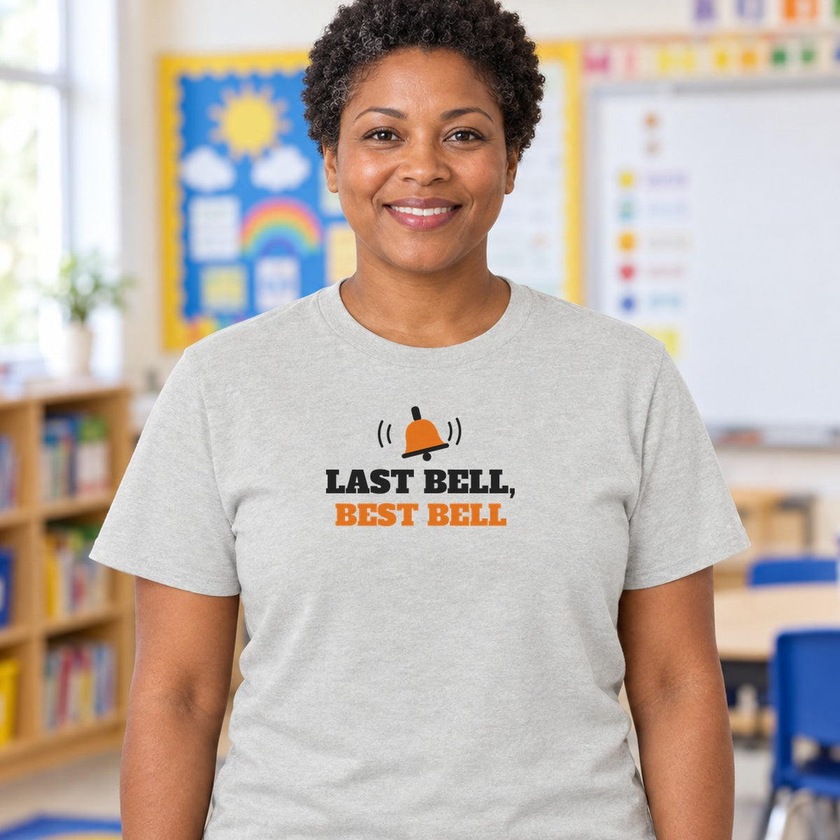 Woman wearing the ash Last Bell, Best Bell graphic tee